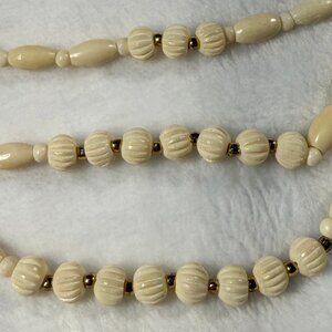 Ivory-like Three Strand necklace; hook clasp